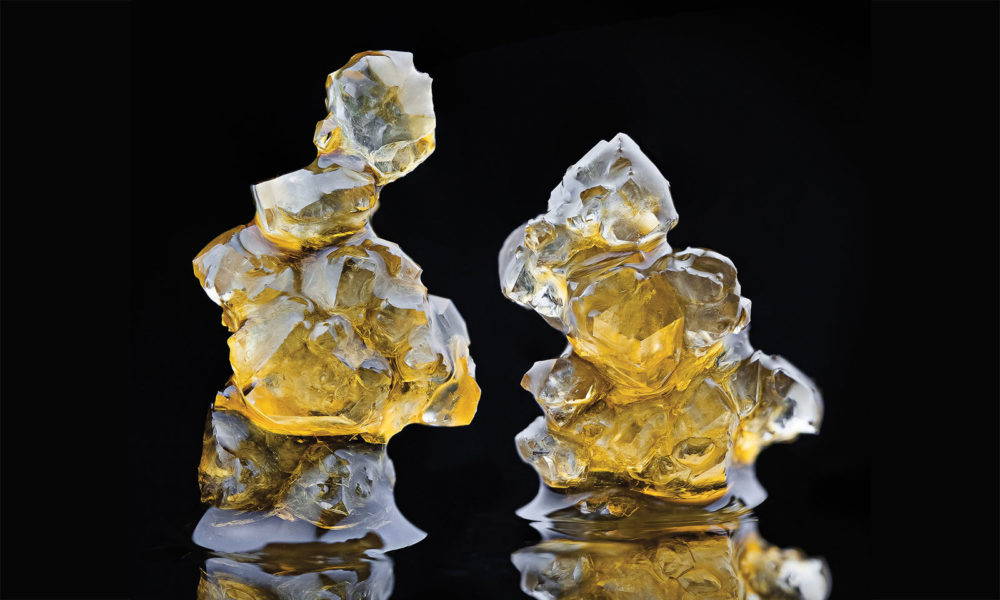 Photo of cannabis THCA diamonds against a black backdrop.