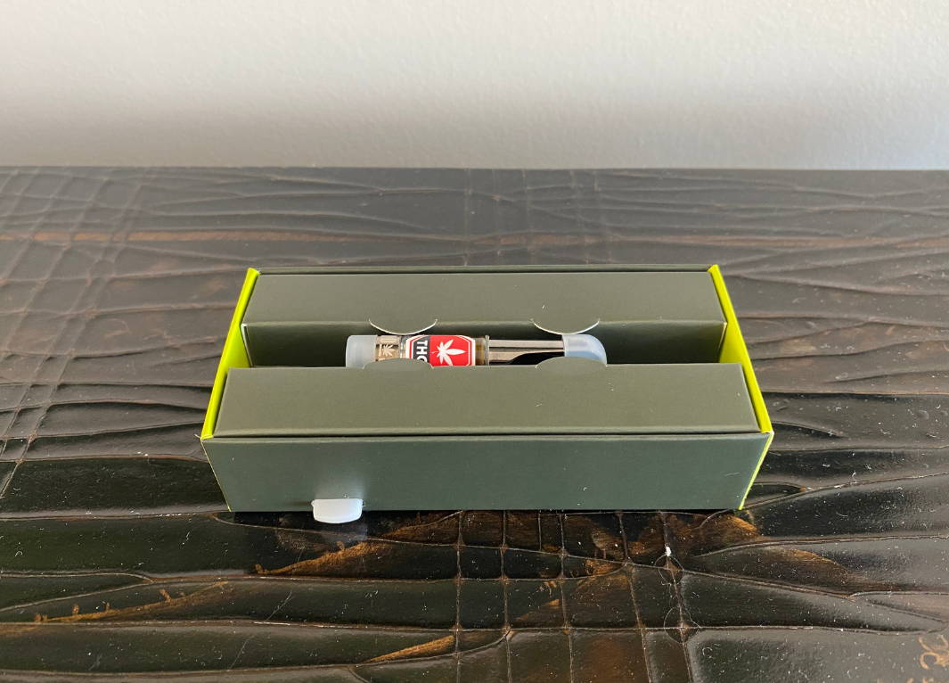 A close of photo of Purple Monkey THC distillate 510 Vape Cartridge.