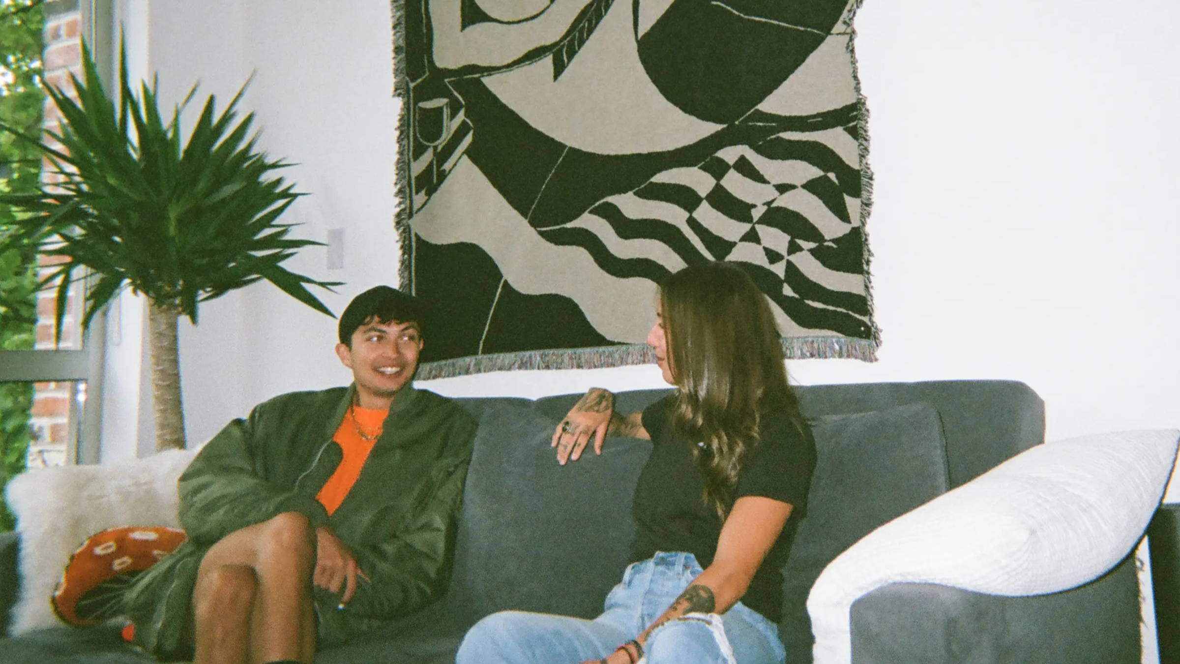 A photo of Venus and our blog writer, Nadia, sitting down on a couch in conversation.